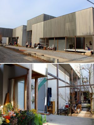 「竜美丘コートビレジ」は周辺の街並みに調和する、格子と塗り壁の外観。郊外の生活に不可欠な各戸2台分の駐車場は、建物を周回する路地に設けている。中庭には緑の潤いもある贅沢な住まいだ