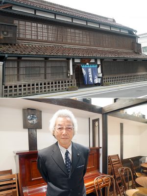 写真上：七日町駅前に佇む「渋川問屋」。明治に建てられたもので、外観がそのまま残っている。当時海産物を会津一円へと運ぶ問屋として栄えた。今は郷土料理を振る舞う飲食店と宿泊施設になっている。店舗の改修などは渋川氏によるものだ<br>
写真下：七日町通りまちなみ協議会 会長の渋川恵男氏