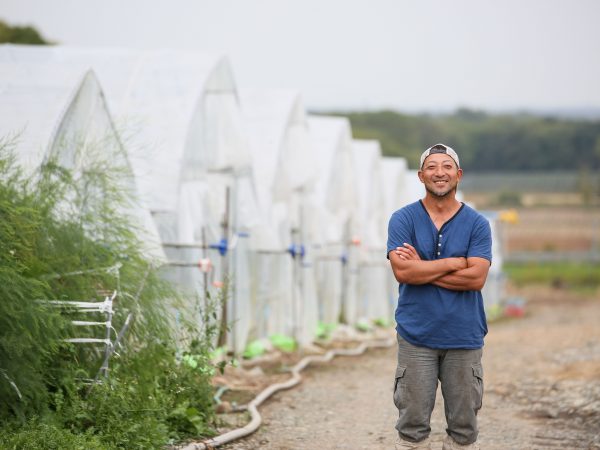 これからも進化していくであろうこの農地に押谷さんの純粋な笑顔が光る