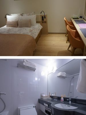 上：部屋を狭く感じさせないよう、壁に向け設置したデスク。ほかにも壁掛けの薄型テレビなど、広々とした雰囲気になる工夫をしている／下：水まわりはすべての部屋で共通の3点ユニット