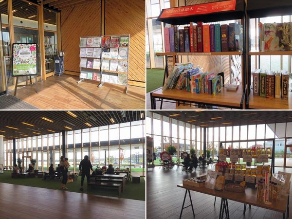 事務所棟内部。入口にはさまざまなイベントのパンフレットが置かれ、入ったところには絵本の掲示。座ってお茶ができたり、お弁当を広げる家族がいたりと自由な雰囲気。地元産物の販売も行われている