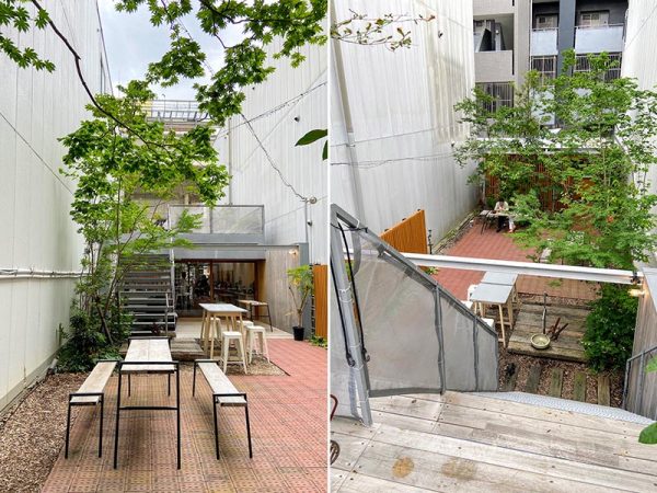 商店街から見たオモケンパーク。アーケードのビルの間にそこだけぽっかりと上空が見える。道路に接して建てると延焼防止のシャッターが必要になるため、前庭を設けて奥まった位置に建てた。通りに面して植栽し、緑の景観を提供する