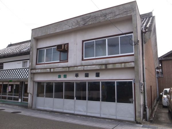 DOCRE結成後間もなくのふたり。市での仕事用の作業着で写した一枚