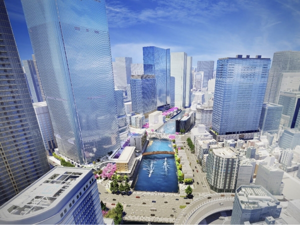 日本橋リバーウォークのイメージパース（江戸橋上空から大手町方面を望む）　※出典：一般社団法人日本橋リバーウォークエリアマネジメント・日本橋一丁目中地区市街地再開発組合・八重洲一丁目北地区市街地再開発組合・日本橋室町一丁目地区市街地再開発組合・日本橋一丁目東地区市街地再開発組合・日本橋一丁目 1・2 番地区市街地再開発組合・首都高速道路株式会社（2025年6月11日）「官民地域一体となり、“水都”としての東京の新しい顔の創出へ　日本橋川を中心とした 5 つの再開発区域とその周辺一帯エリア『日本橋リバーウォーク』の情報発信を開始」