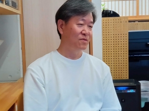 ずっと不動産一筋、建築は実践の中で身につけてきたという尾上さん（編集部撮影）